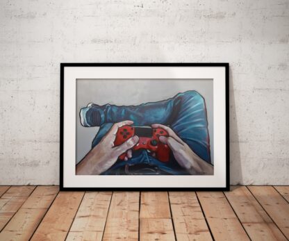 Console gamer painting framed on floor against white wall